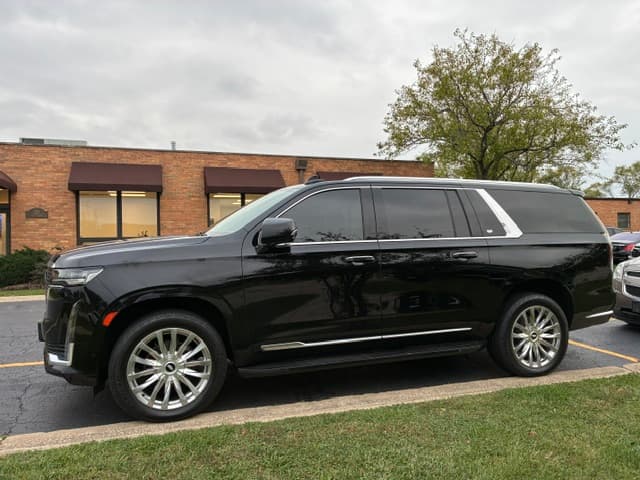 Black Cadillac Escalade luxury SUV side profile